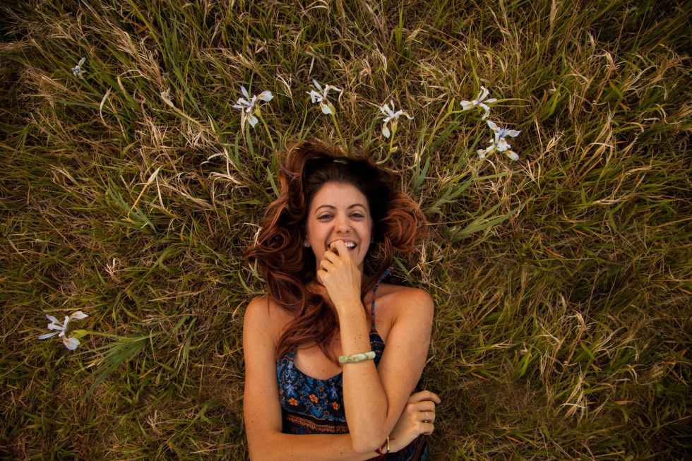 woman wearing blue and multicolored floral cami top